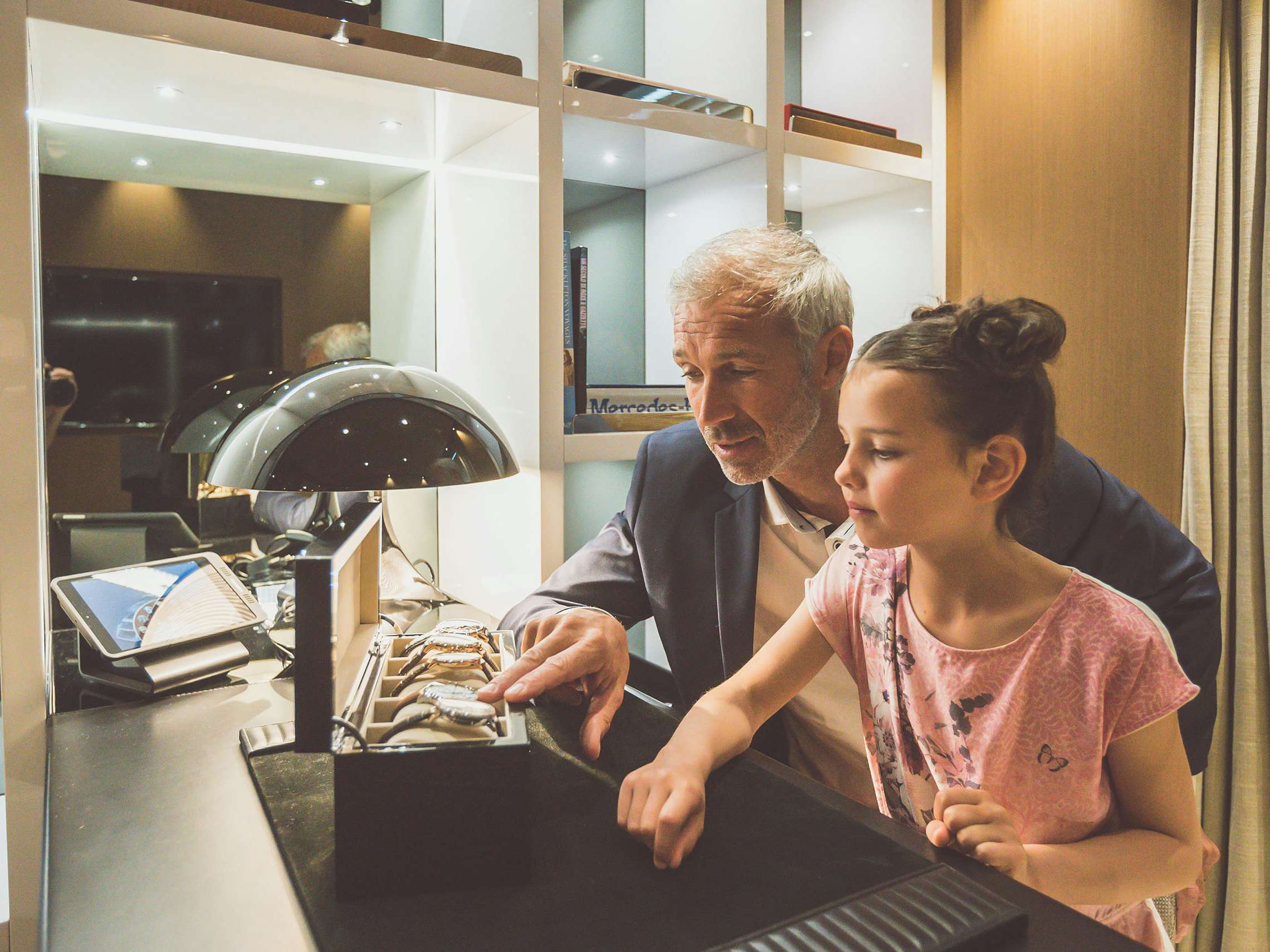 Concierge-Services_Shopping Yacht owner showing his watch collection to young daughter