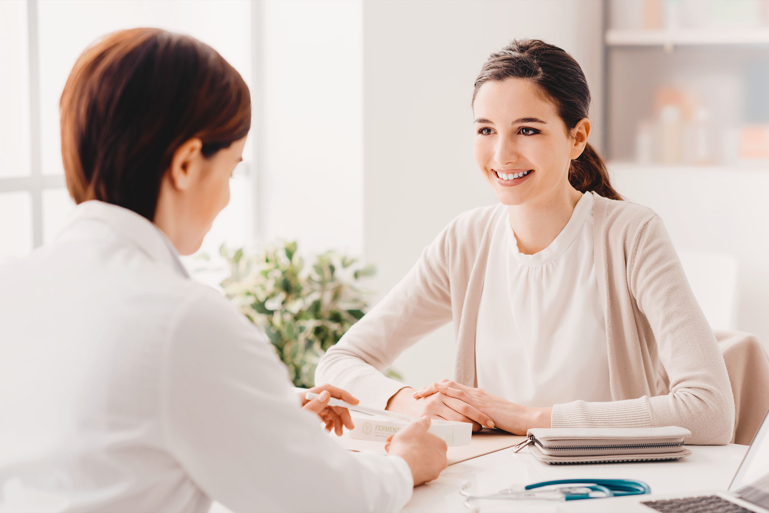 Young crew member consulting her doctor in person