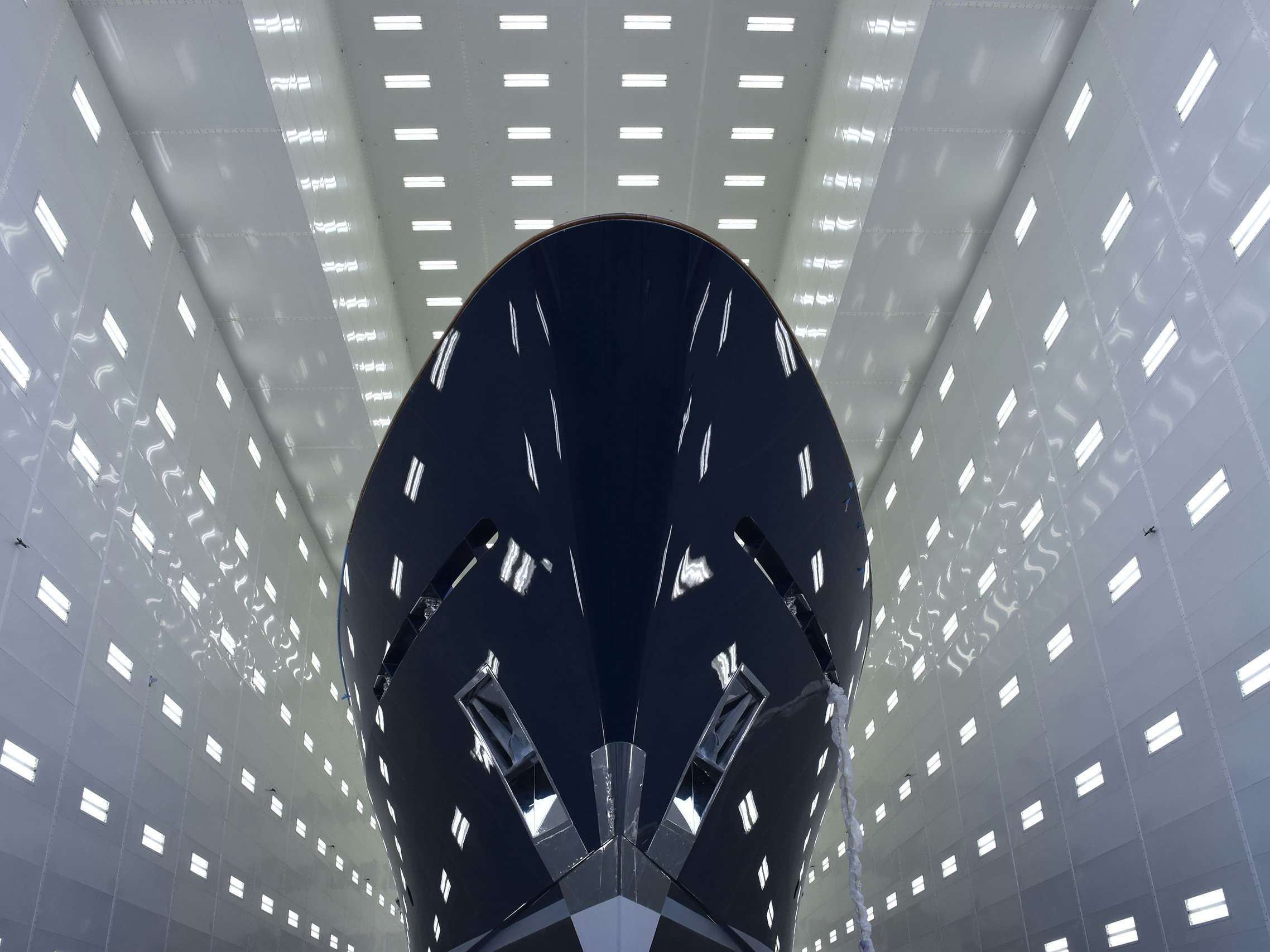 Safety_Security_Compliance_Hero Yacht photographed out of the water inside painting facility